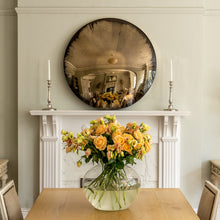 Load image into Gallery viewer, Aged Bronze Round Convex Mirror above a period mantlepiece and flanked by candles