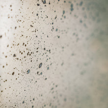 Load image into Gallery viewer, Detail of aged silver round convex mirror showing silver plate with foxing finish