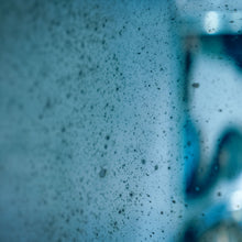 Load image into Gallery viewer, Close up detail of Aged Blue Round Convex Mirror showing blue plate and foxing